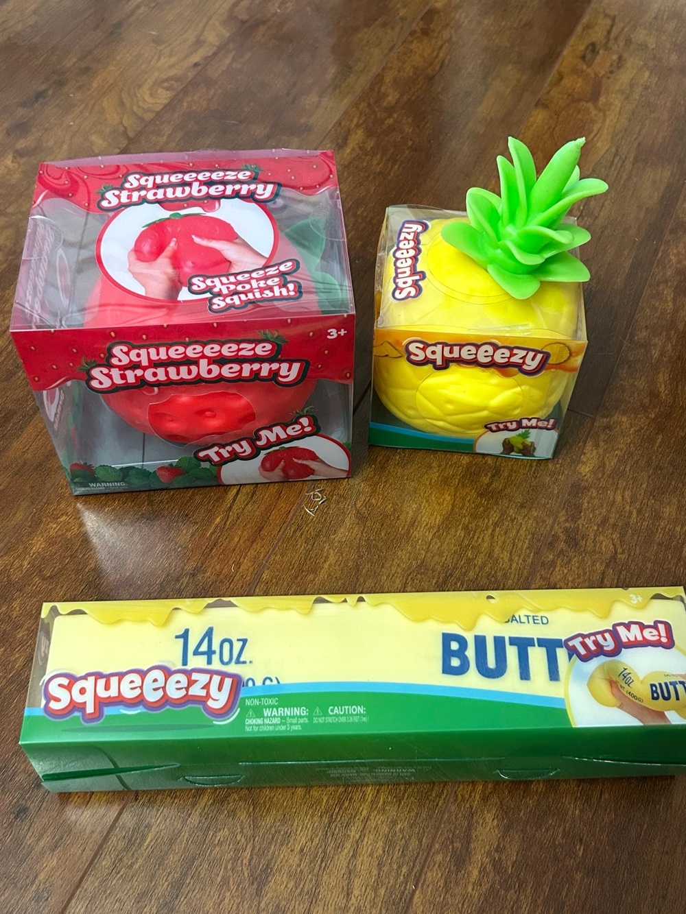 (3) Sunny Days Squeezies.  (1) Strawberry, (1) Pineapple and (1) Butter